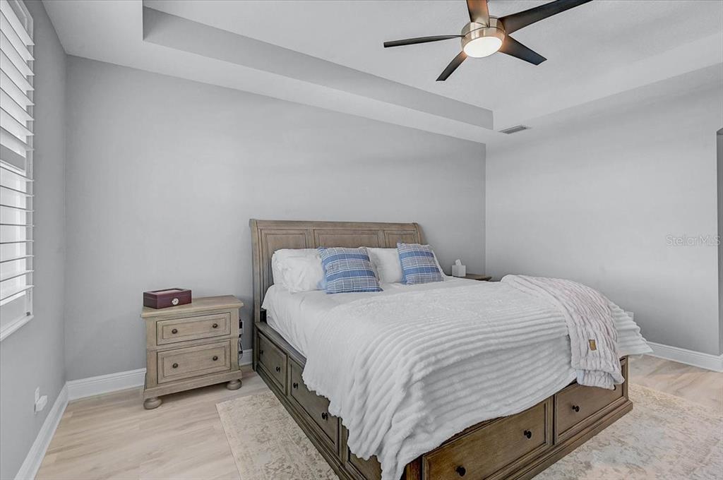 1258 Riverscape Street, Unit A Bradenton, FL 34208 - Photo 24 of 63 a bedroom with a bed and a dresser