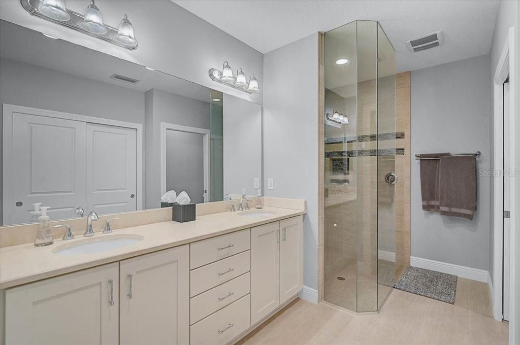 1258 Riverscape Street, Unit A Bradenton, FL 34208 - Photo 26 of 63 a bathroom with double sink and mirror