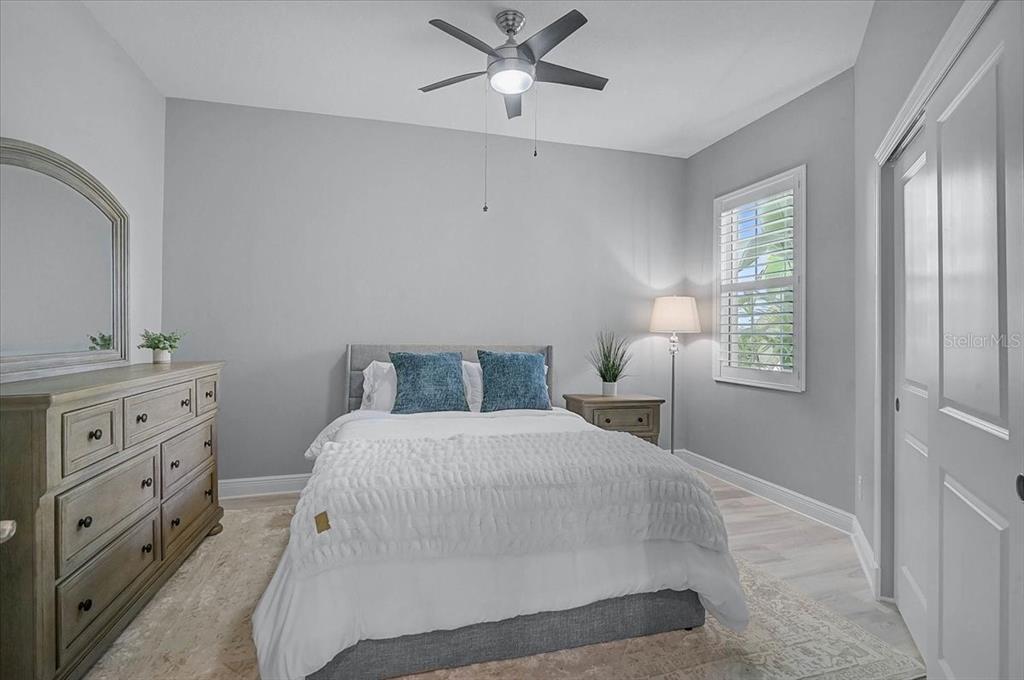 1258 Riverscape Street, Unit A Bradenton, FL 34208 - Photo 31 of 63 a bedroom with a bed and a dresser with window