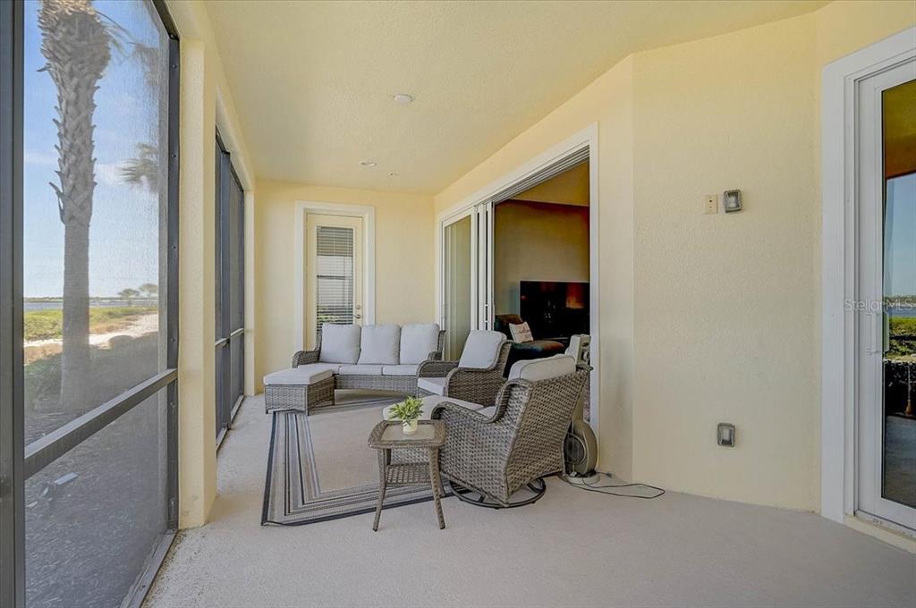 1258 Riverscape Street, Unit A Bradenton, FL 34208 - Photo 33 of 63 a living room with furniture and a flat screen tv