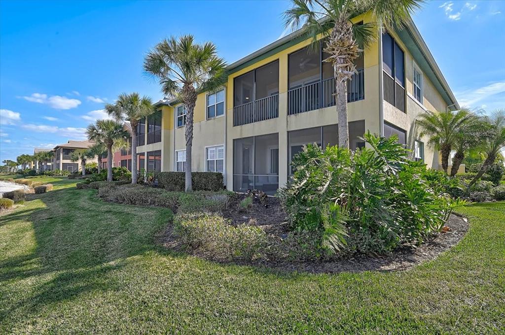 1258 Riverscape Street, Unit A Bradenton, FL 34208 - Photo 34 of 63 a view of a house with a yard and potted plants