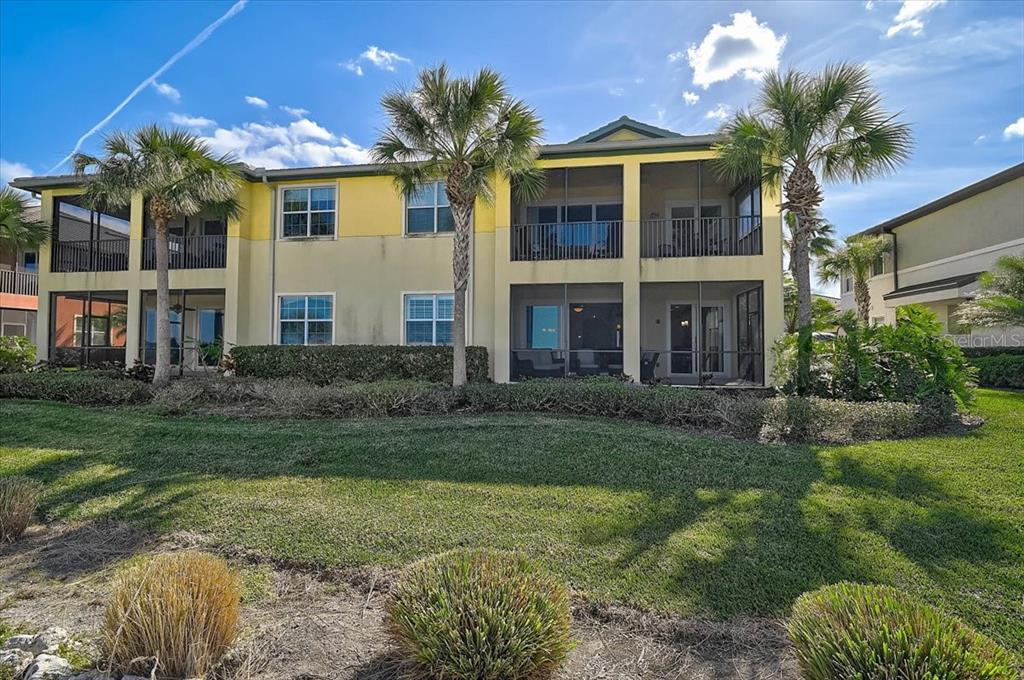1258 Riverscape Street, Unit A Bradenton, FL 34208 - Photo 35 of 63 a front view of a house with a yard