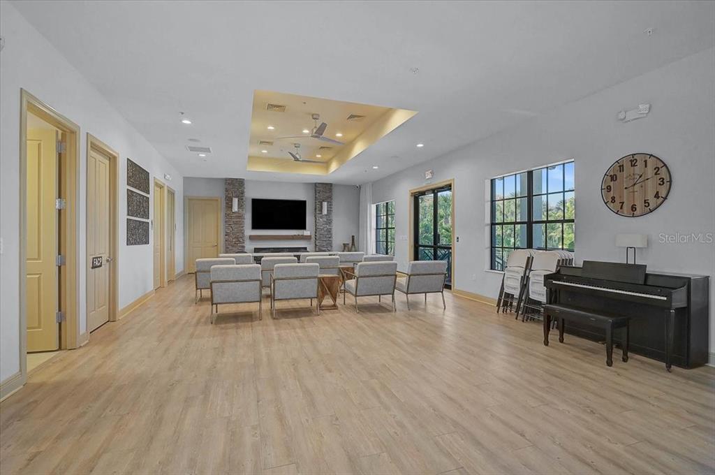1258 Riverscape Street, Unit A Bradenton, FL 34208 - Photo 42 of 63 a living room with furniture and a flat screen tv