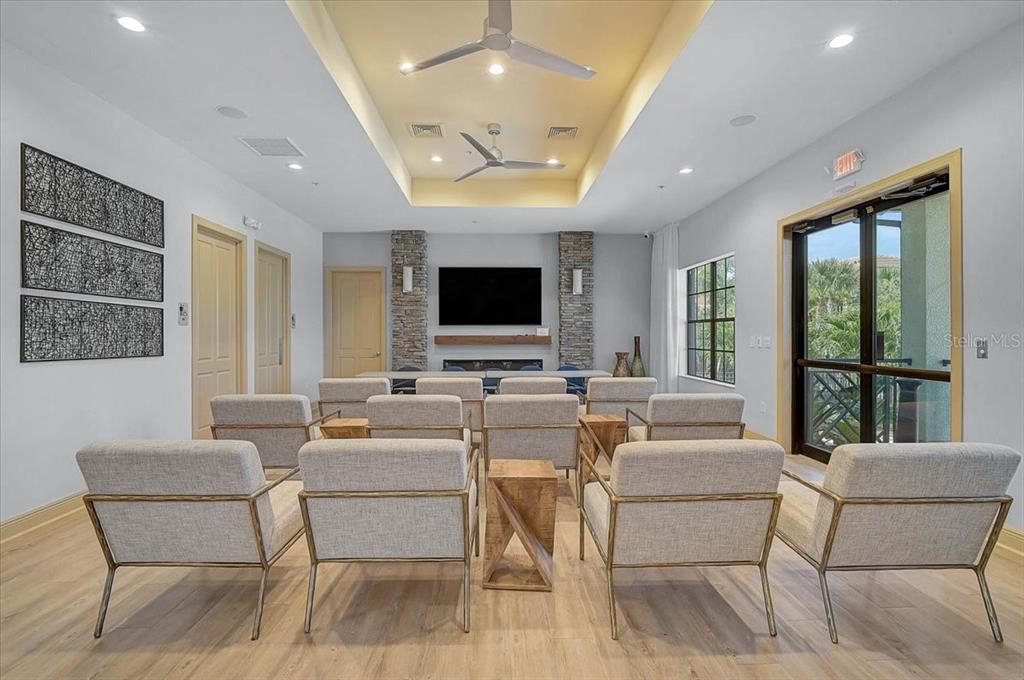1258 Riverscape Street, Unit A Bradenton, FL 34208 - Photo 44 of 63 a living room with fireplace furniture and a flat screen tv