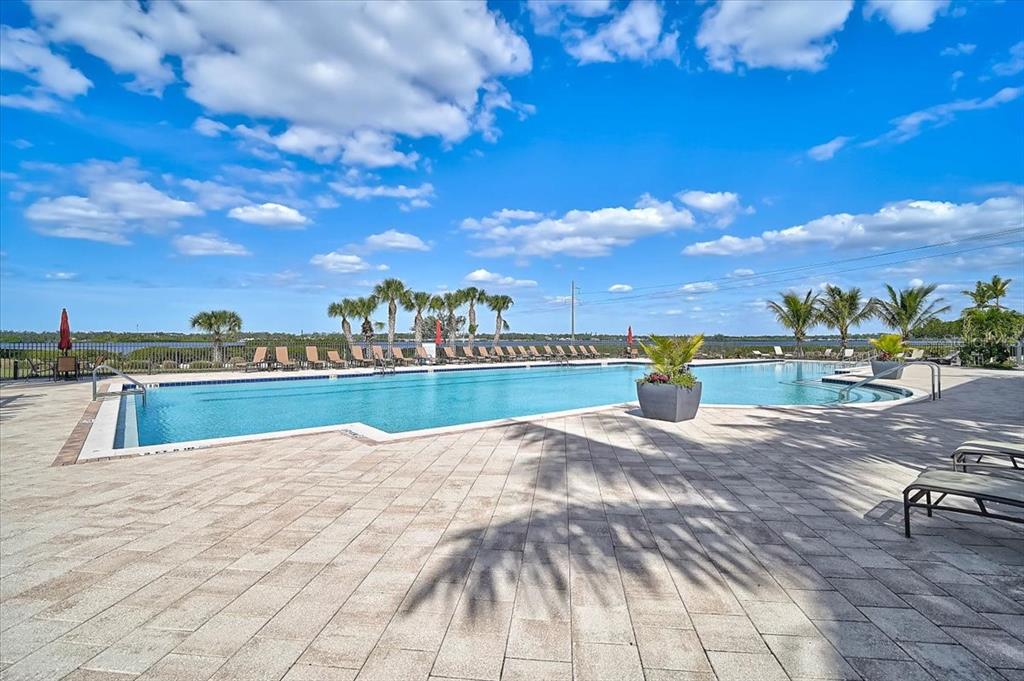 1258 Riverscape Street, Unit A Bradenton, FL 34208 - Photo 49 of 63 a view of swimming pool with outdoor seating and yard in back