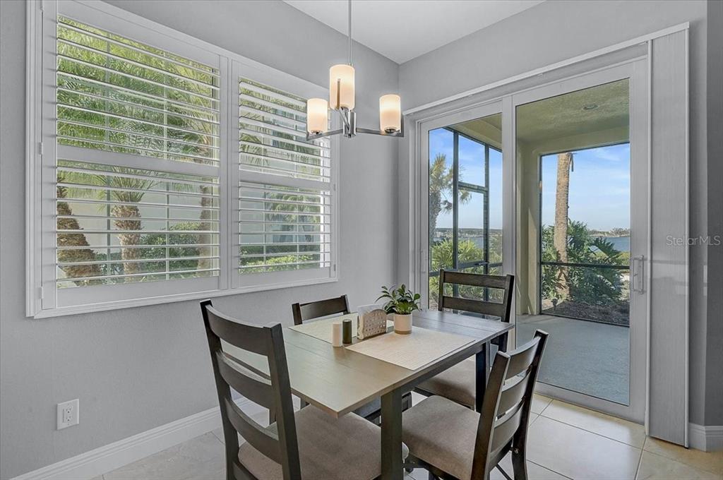 1258 Riverscape Street, Unit A Bradenton, FL 34208 - Photo 9 of 63 a view of a dining room with furniture window and outside view