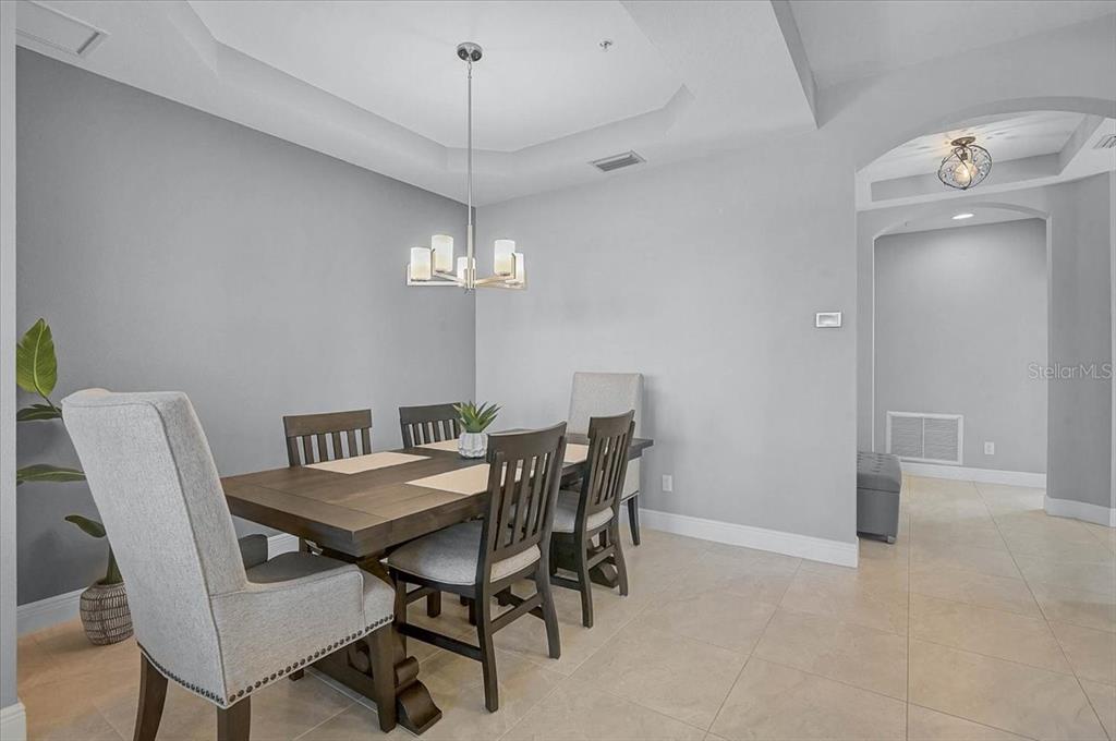1258 Riverscape Street, Unit A Bradenton, FL 34208 - Photo 10 of 63 a view of a dining room with furniture and chandelier