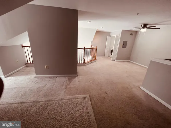 a view of a livingroom with a staircase