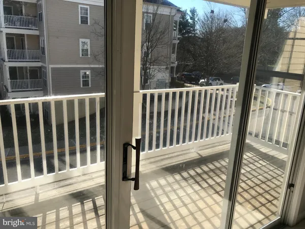 a view of a porch with a floor to ceiling window