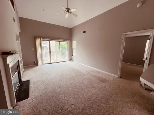 a view of livingroom with hardwood floor and a ceiling fan