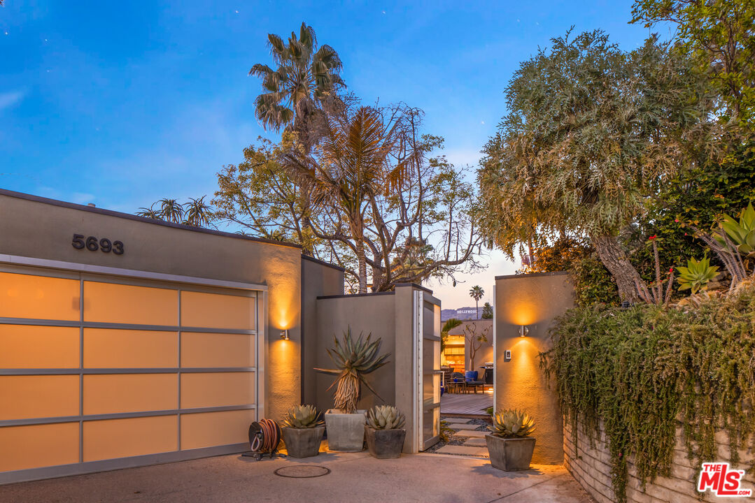 5693 Holly Oak Drive Los Angeles, CA 90068 - Photo 1 of 26 a view of backyard with a large tree