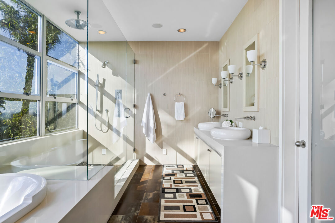 5693 Holly Oak Drive Los Angeles, CA 90068 - Photo 11 of 26 a bathroom with a sink and a mirror