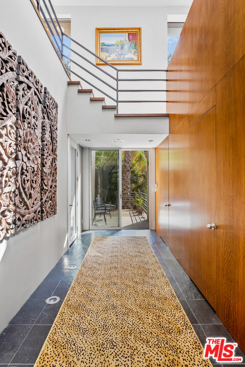 5693 Holly Oak Drive Los Angeles, CA 90068 - Photo 13 of 26 a view of a hallway with windows