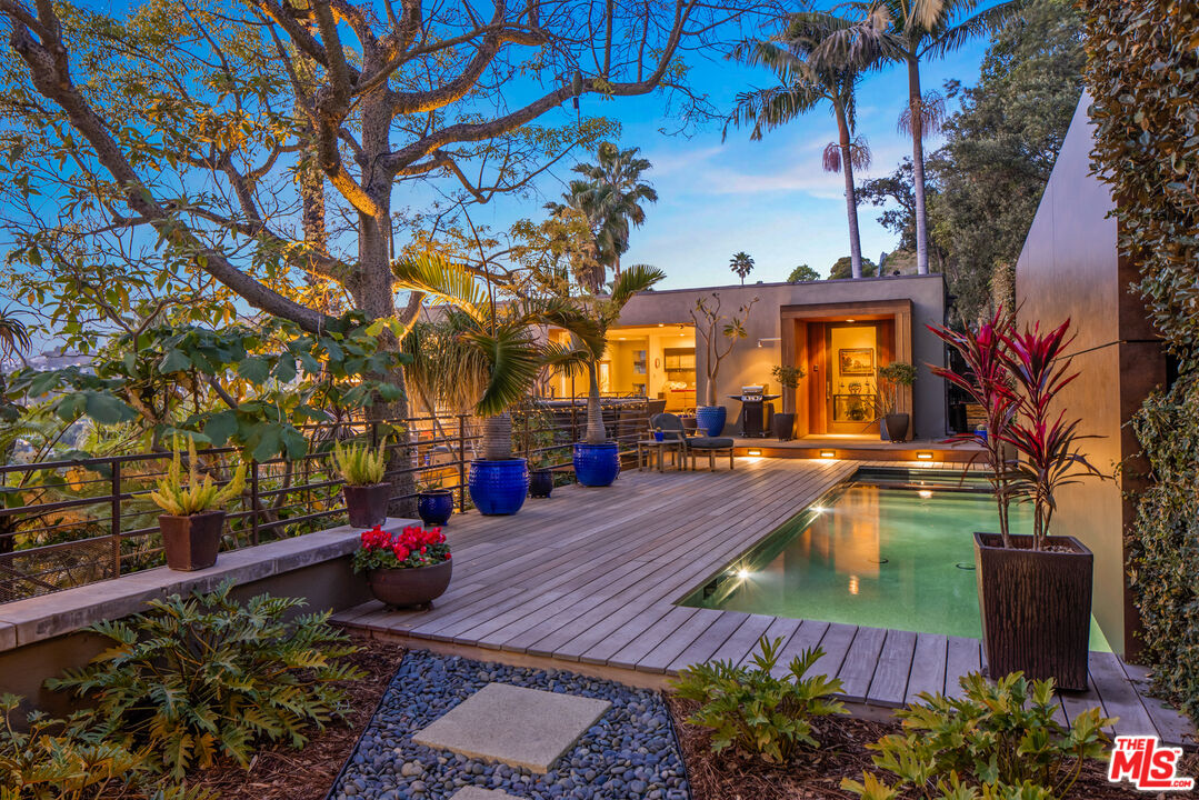 5693 Holly Oak Drive Los Angeles, CA 90068 - Photo 2 of 26 a view of a swimming pool with a patio