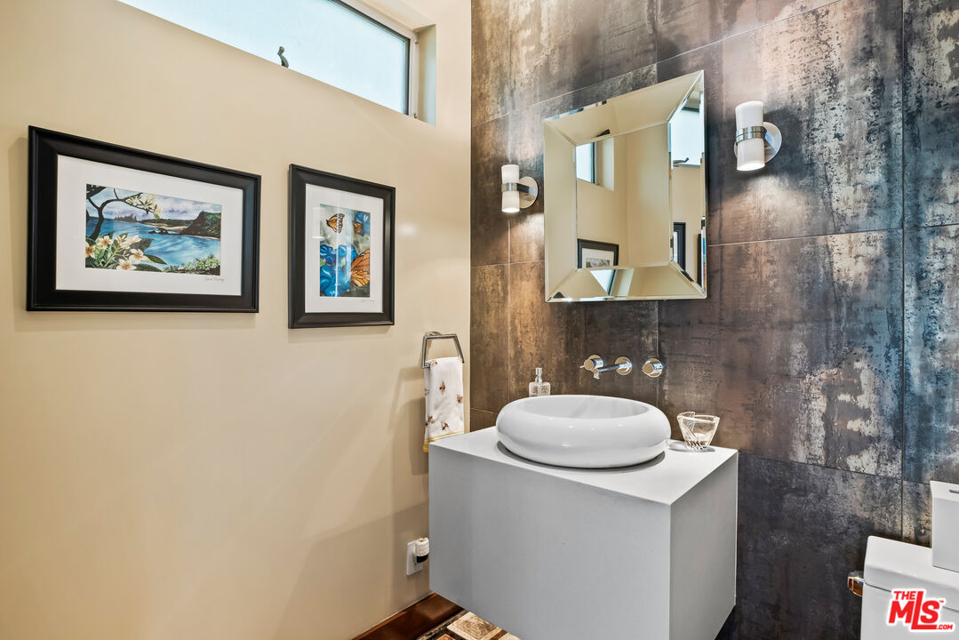 5693 Holly Oak Drive Los Angeles, CA 90068 - Photo 9 of 26 a bathroom with a toilet and a sink