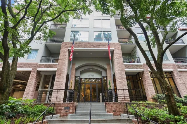 a view of a building with a tree