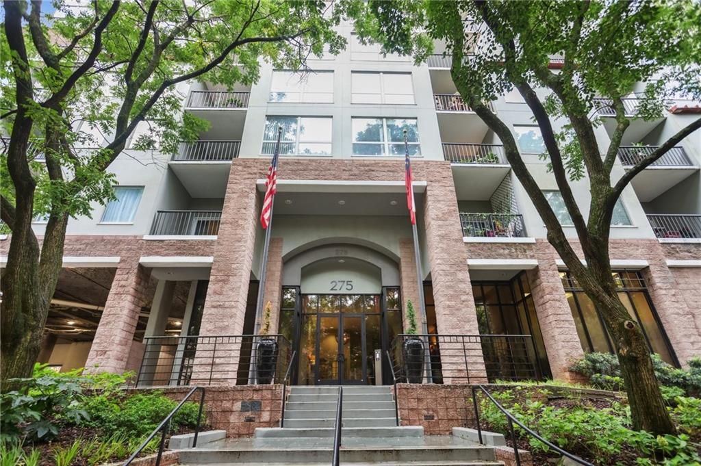 275 13th Street Northeast, Unit 312 Atlanta, GA 30309 - Photo 30 of 31 a view of a building with a tree