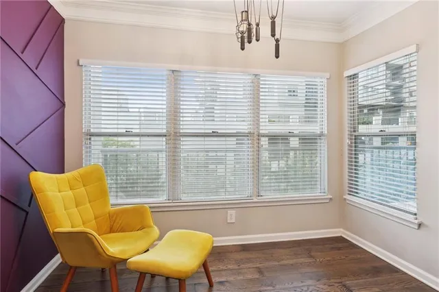 a view of a dining room with furniture and windows
