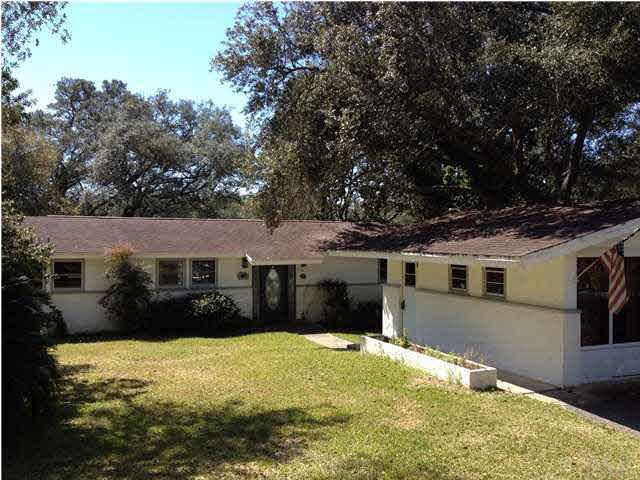 Front view of home and separate laundry/storage building