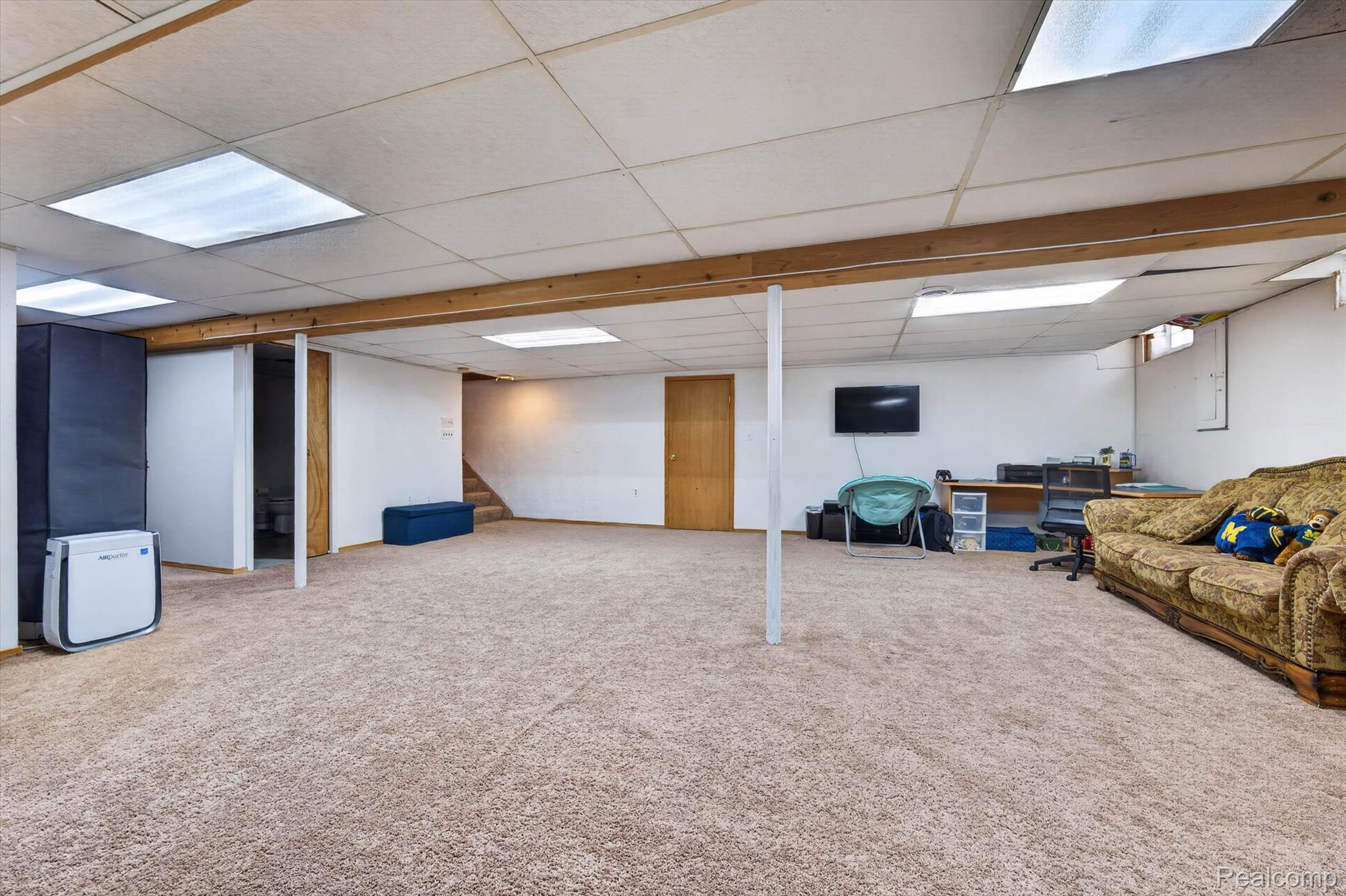 46362 Springhill Drive Utica, MI 48317 - Photo 33 of 59 Spacious lower level featuring light brown carpeting throughout