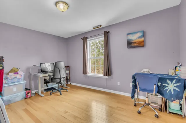 a workspace with furniture and a window