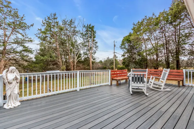 a view of a chairs and table on the wooden floor