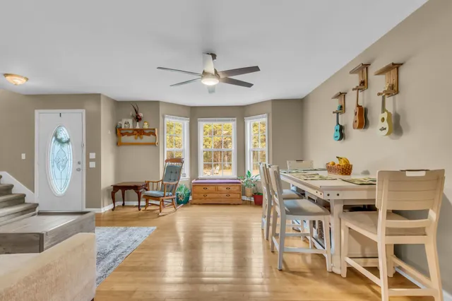 a view of a dining room with furniture window and wooden floor