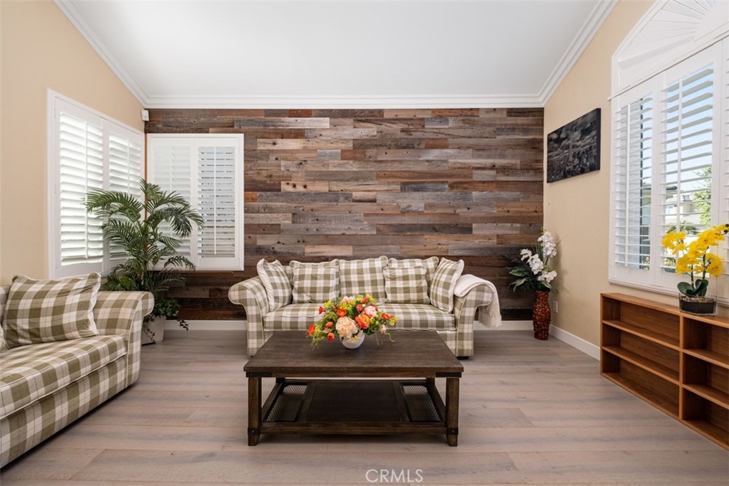 2 Field Point Rancho Santa Margarita, CA 92679 - Photo 8 of 23 Living room with plantations shutters, crown molding and newer floors.