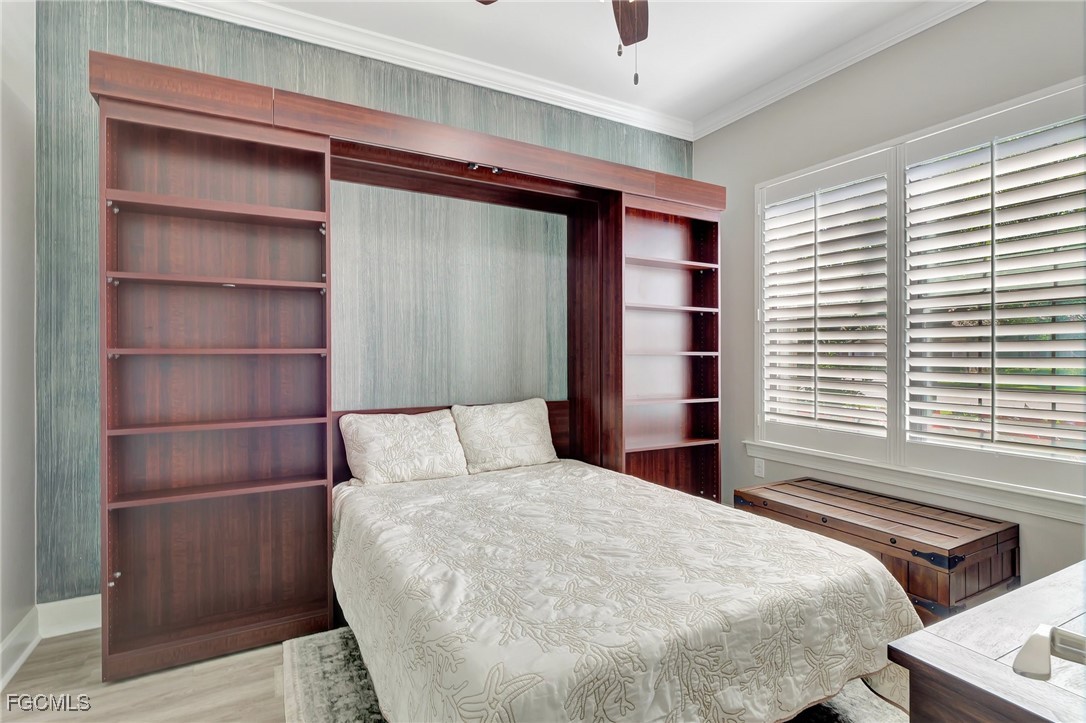11716 Avingston Terrace Fort Myers, FL 33913 - Photo 14 of 49 a large bed sitting in a bedroom next to a window