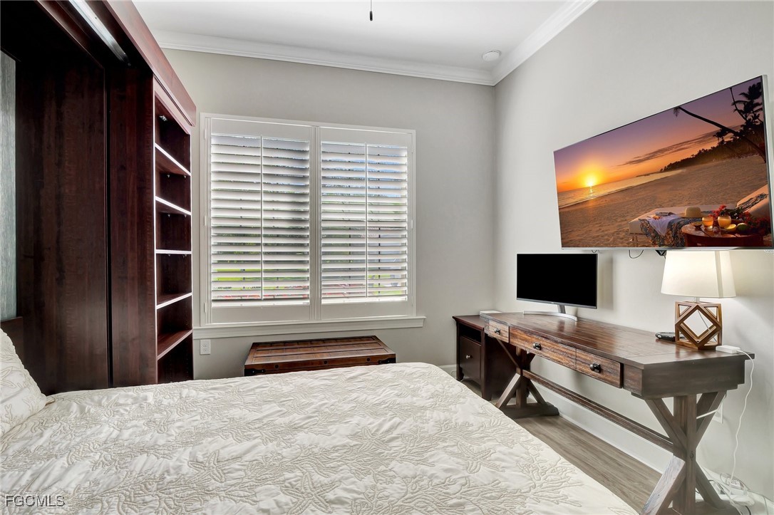 11716 Avingston Terrace Fort Myers, FL 33913 - Photo 16 of 49 a bedroom with a bed and a flat screen tv