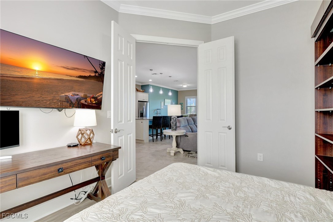 11716 Avingston Terrace Fort Myers, FL 33913 - Photo 18 of 49 a bedroom with a bed and a view of bathroom