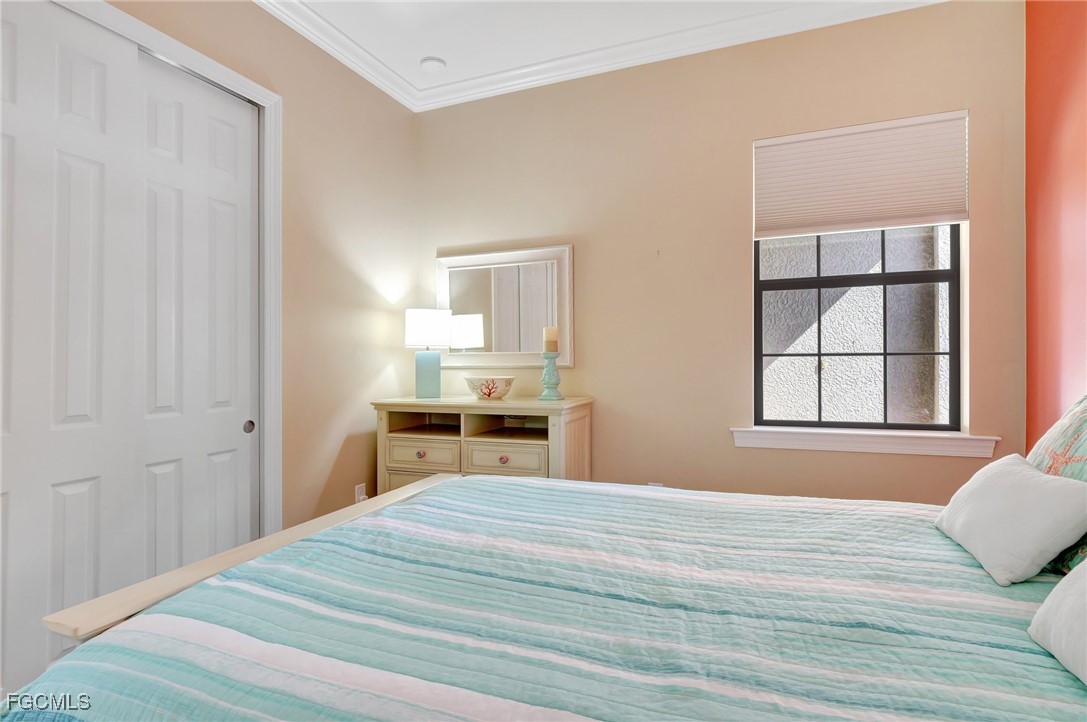 11716 Avingston Terrace Fort Myers, FL 33913 - Photo 24 of 49 a bedroom with a bed and wooden floor