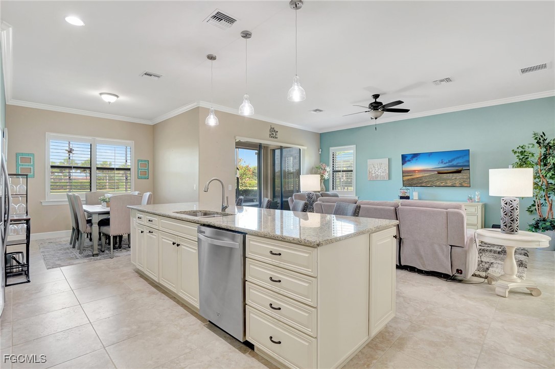 11716 Avingston Terrace Fort Myers, FL 33913 - Photo 7 of 49 a kitchen with white cabinets and sink