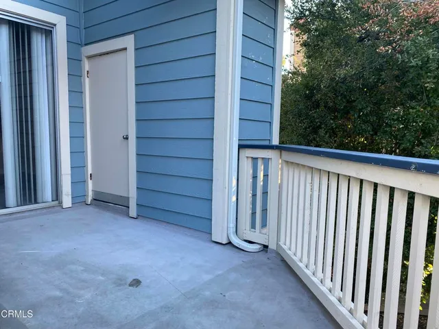a view of a house with a backyard space