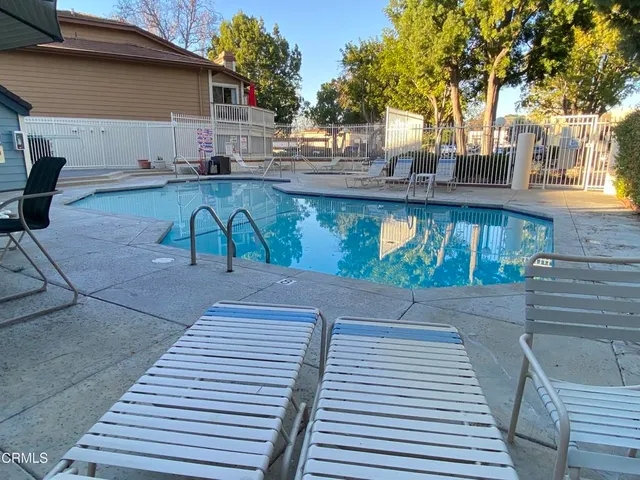 a view of a backyard with sitting area