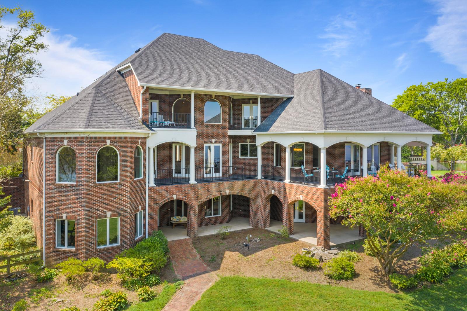 Enjoy the magnificent views from any one of the impressive covered porches. Lakes views were taking into account when designing this home