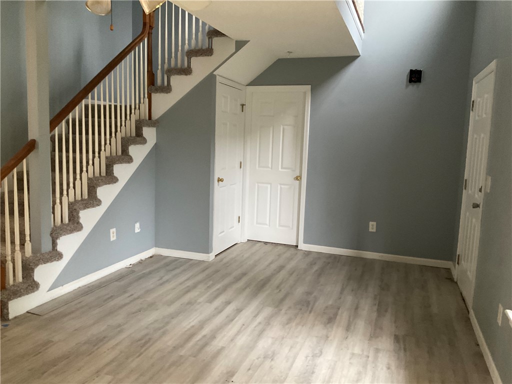 102 Soaring Hawk Court Anderson, SC 29621 - Photo 8 of 15 Smooth wood-look flooring and a soaring ceiling define this welcoming entry space.