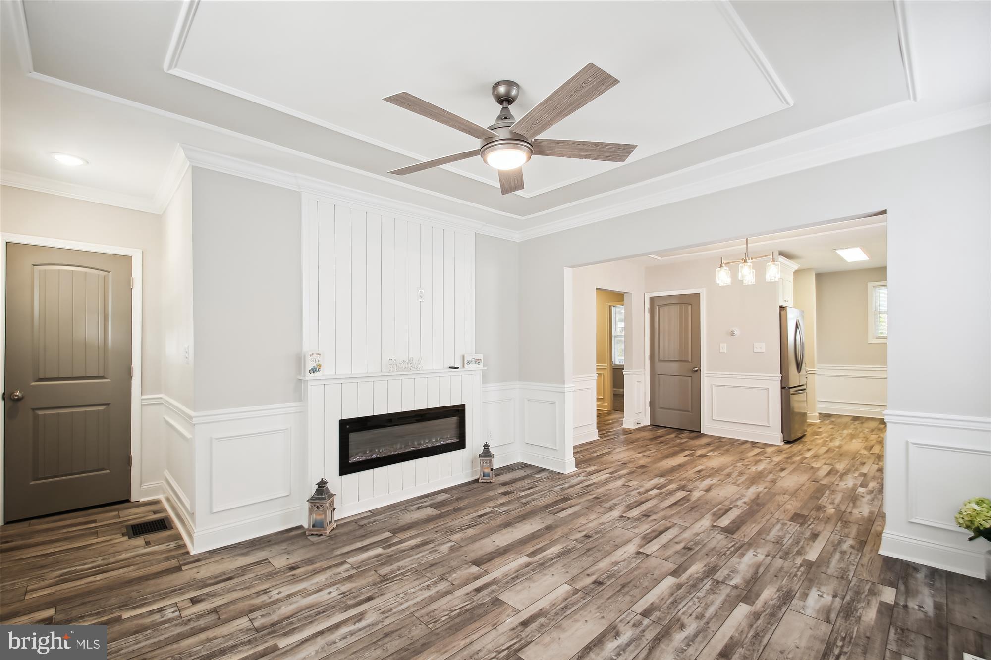 106 Charles Road Linthicum Heights, MD 21090 - Photo 4 of 44 a view of a livingroom with a ceiling fan wooden floor and window