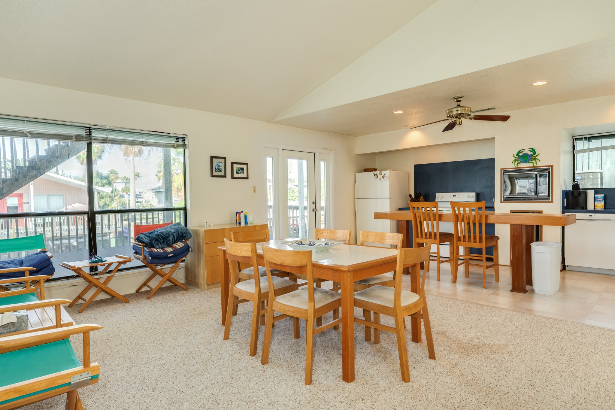 16708 Cormorant Road Jamaica Beach, TX 77554 - Photo 13 of 33 Front entry way, kitchen and dining area view. This space is quite large and has a vaulted ceiling making if feel even more spacious.