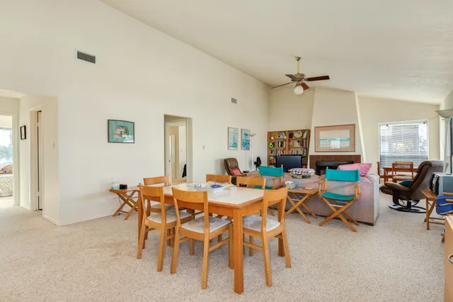 a view of a livingroom with furniture and a window