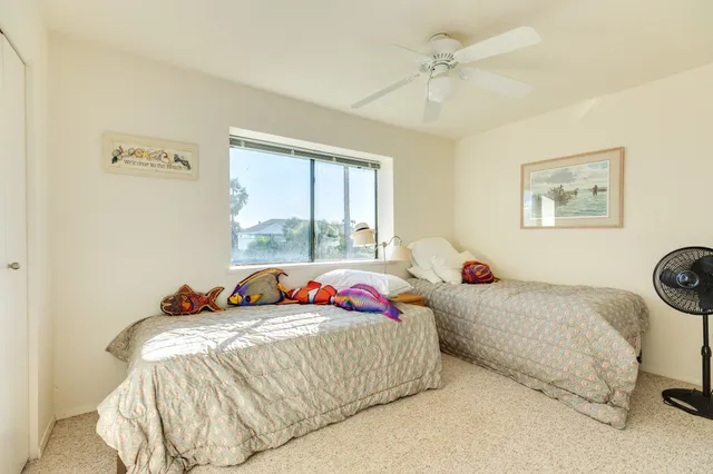 a bedroom with bed and a window