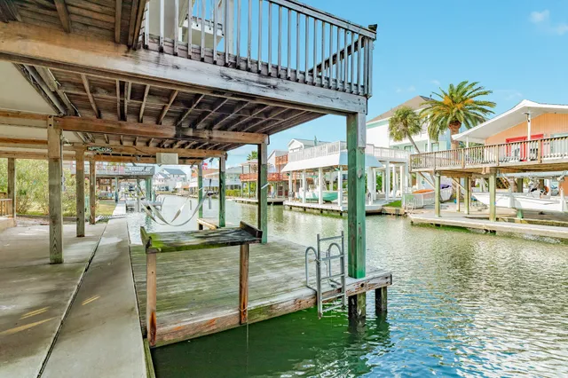 a view of a swimming pool with outdoor seating