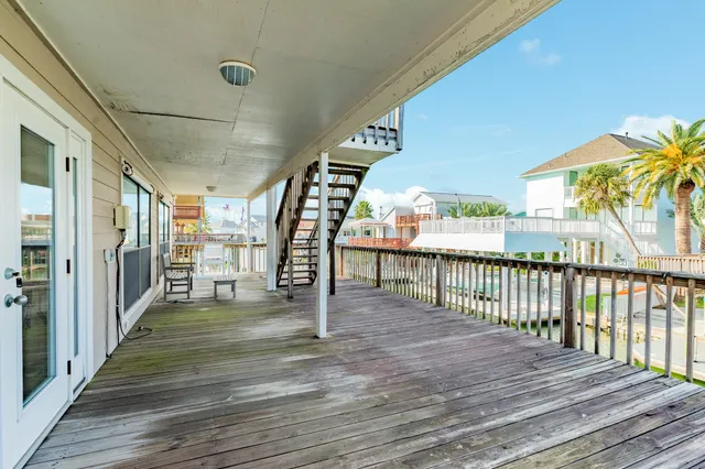 a view of a porch with wooden floor and outdoor space