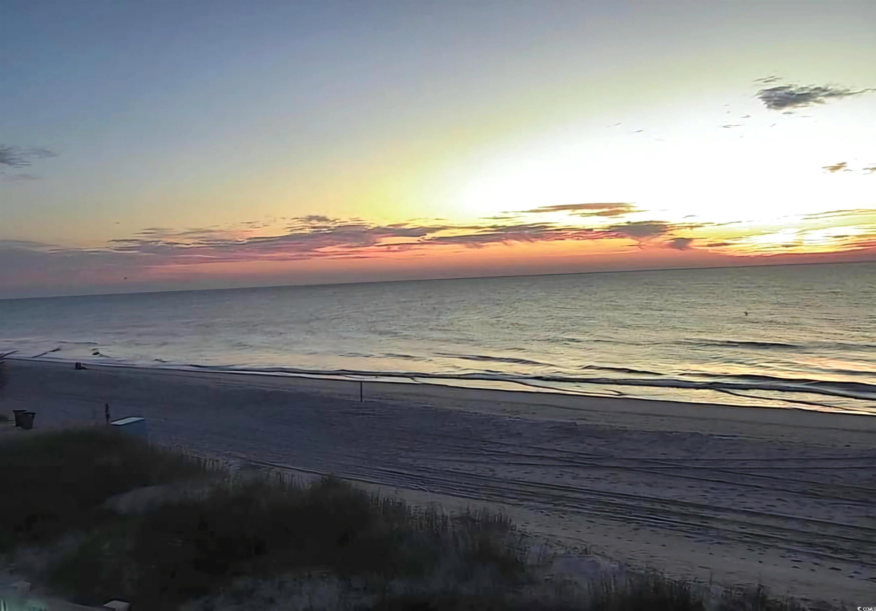 301 North Waccamaw Drive, Unit 211 Murrells Inlet, SC 29576 - Photo 29 of 37 Water view featuring local beach