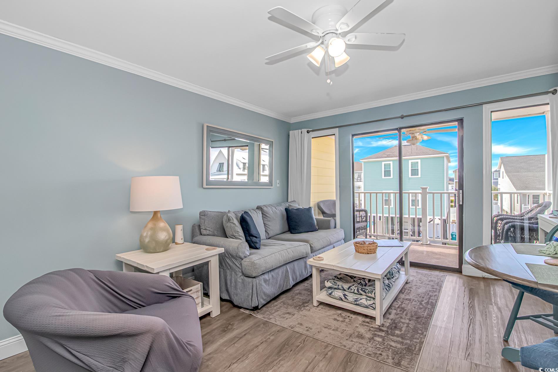 301 North Waccamaw Drive, Unit 211 Murrells Inlet, SC 29576 - Photo 3 of 37 Living room with ornamental molding, wood finished floors, and ceiling fan