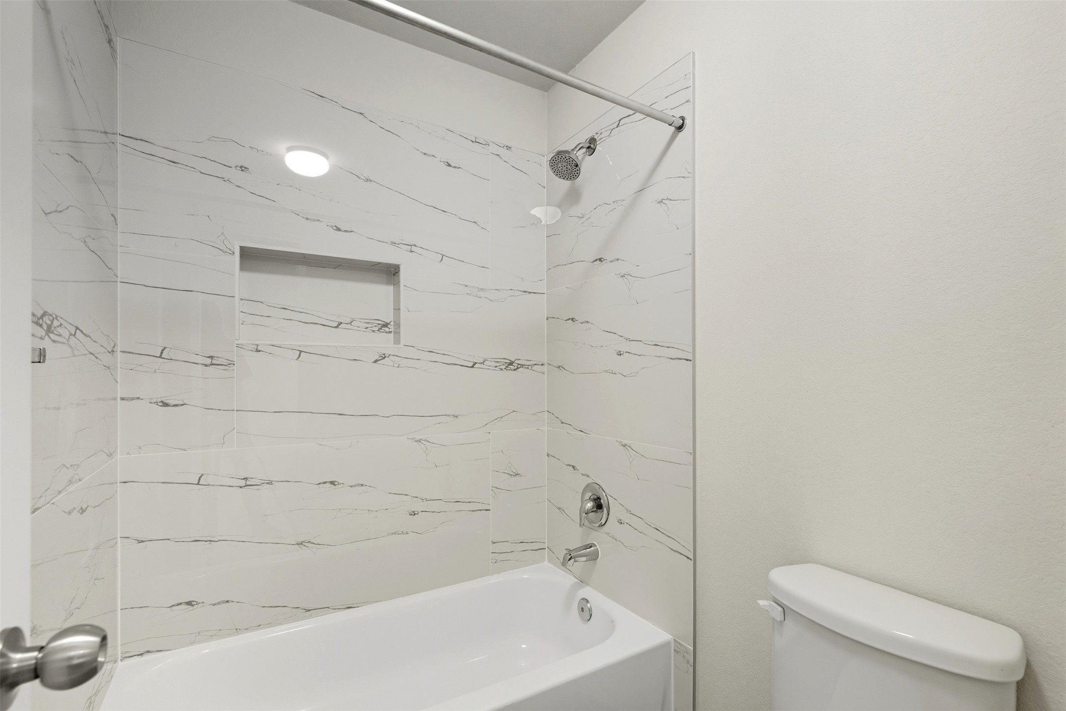 18414 West Hardy Road Houston, TX 77073 - Photo 18 of 46 a bathroom with a toilet and shower