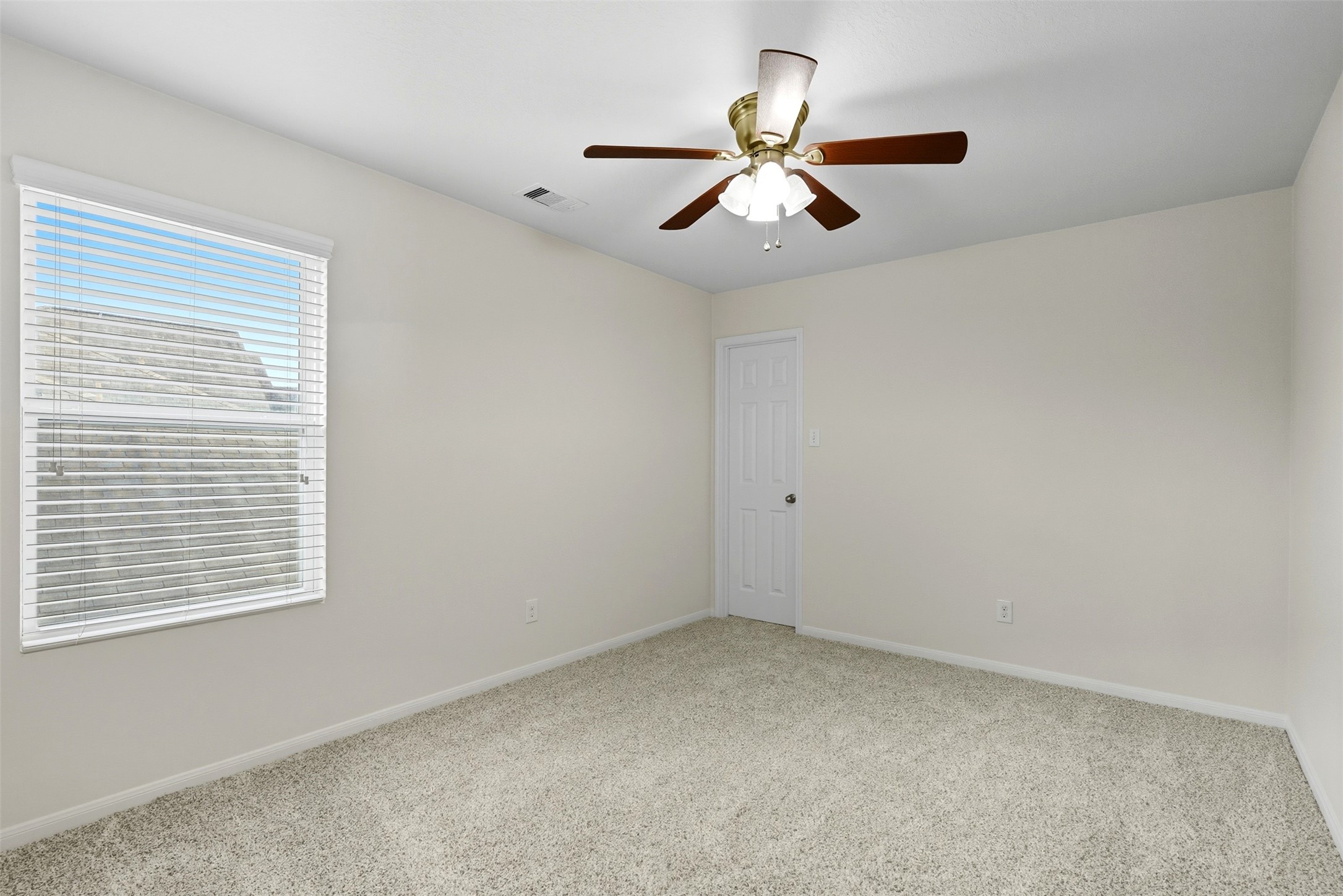 18414 West Hardy Road Houston, TX 77073 - Photo 19 of 46 a view of room with ceiling fan and windows