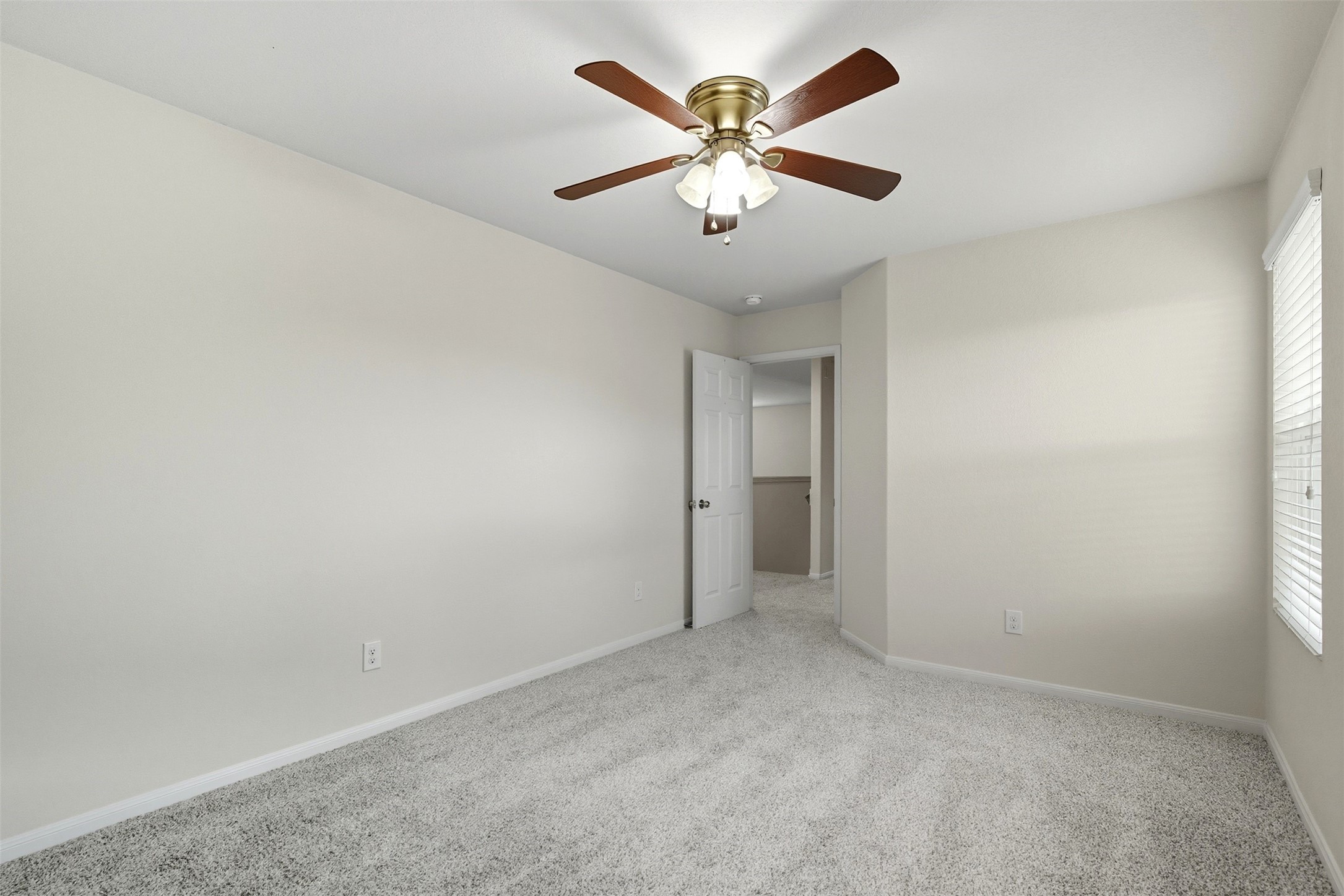 18414 West Hardy Road Houston, TX 77073 - Photo 20 of 46 an empty room with a fan & a window