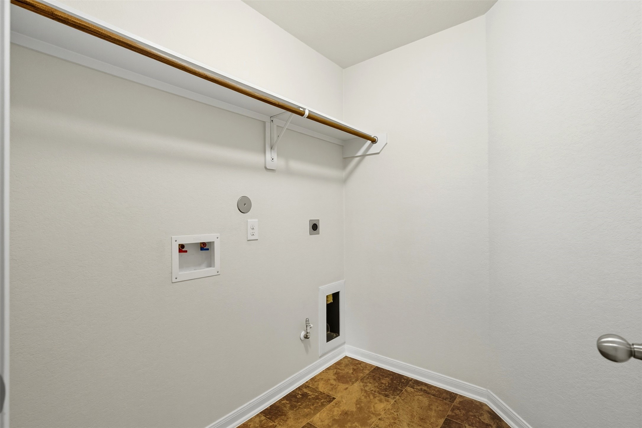 18414 West Hardy Road Houston, TX 77073 - Photo 21 of 46 a view of a room with racks on the wall