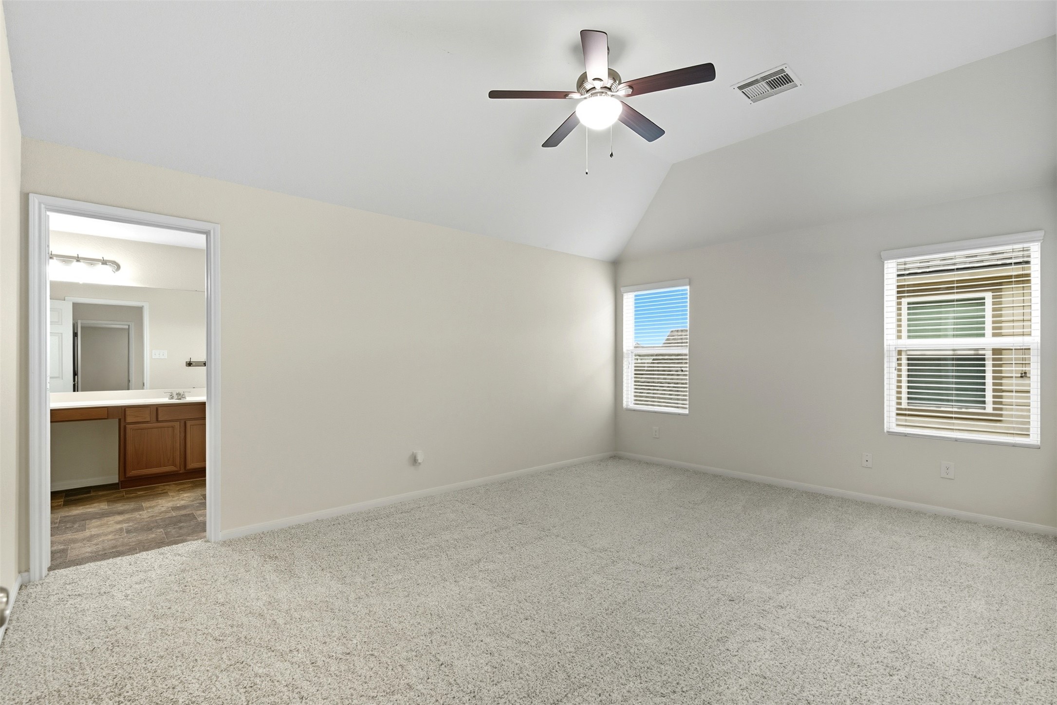 18414 West Hardy Road Houston, TX 77073 - Photo 22 of 46 a view of room with a ceiling fan and a window